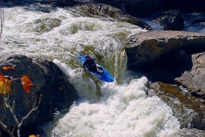 Kayaking down a small waterfall