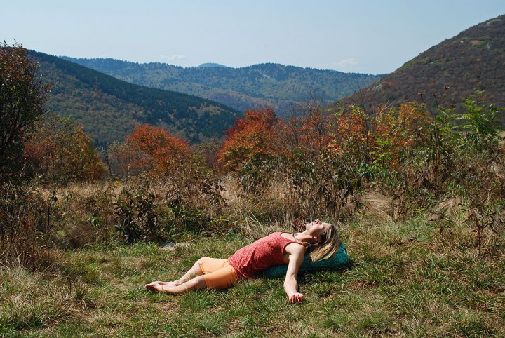 Demonstrating reclining bound angle pose.